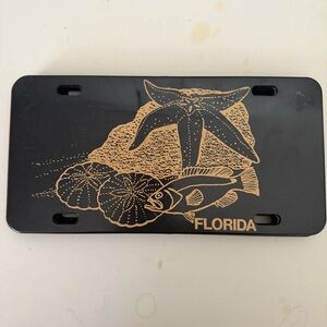 Vintage Florida sealife Novelty License Plate Plastic Black And Gold